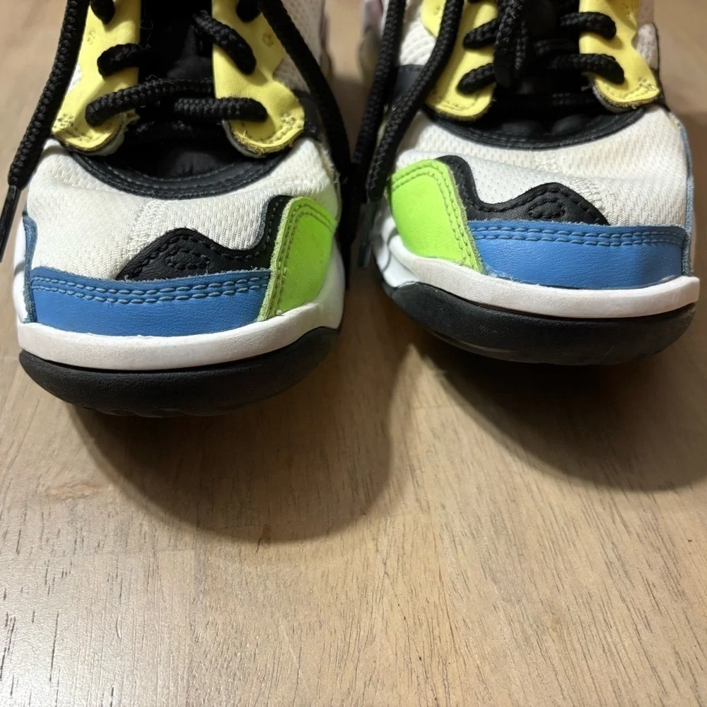 Nike Air Jordan’ size 6 Youth white, black, blue, yellow, pink.